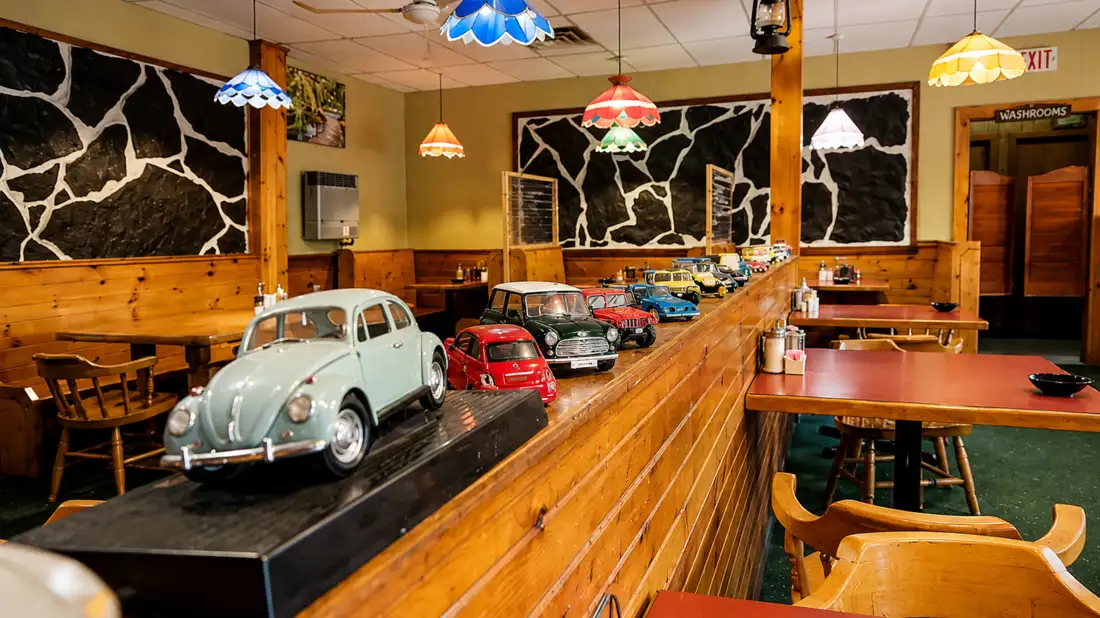 Collection of vintage model cars inside Top Notch Breakfast Restaurant
