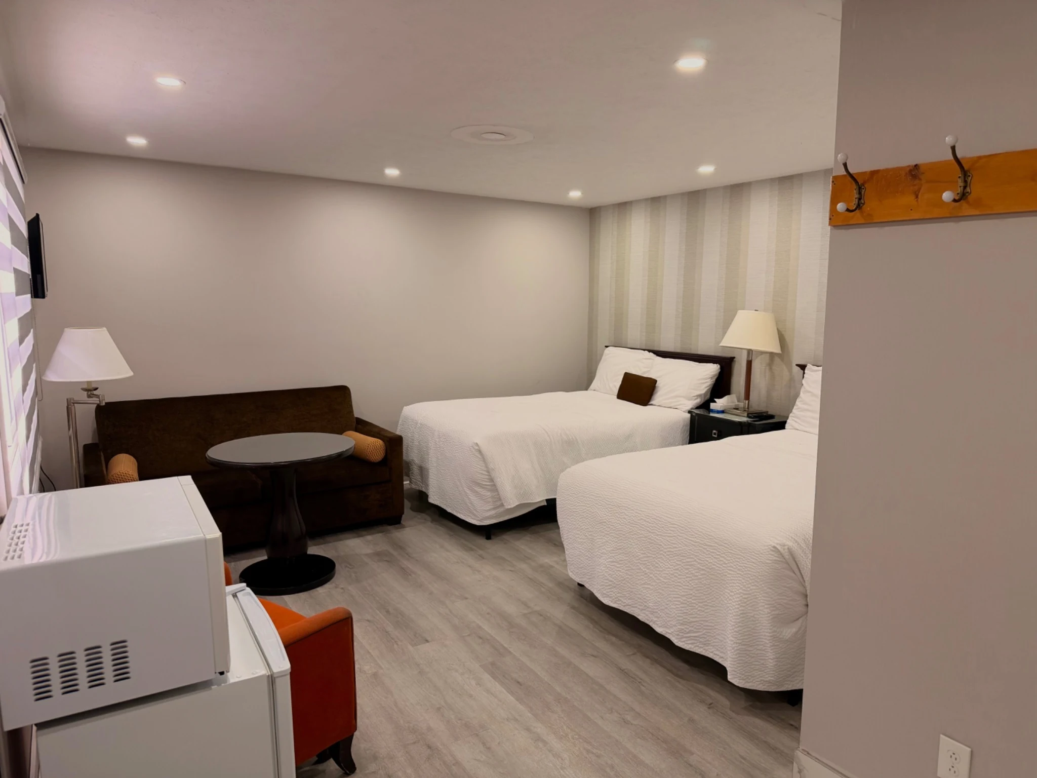 Two double beds and sofa bed inside the Family Room
